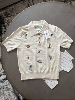 Exclusive 2026 Masters Berckmans x Tory Burch Cashmere Top.